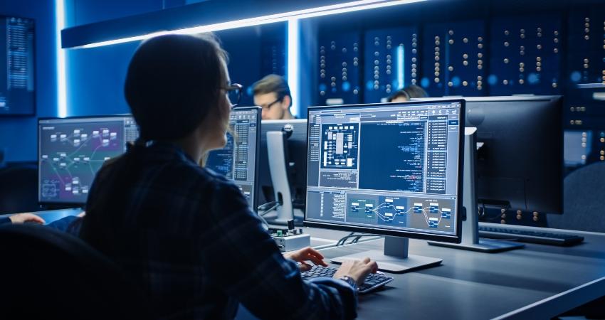 woman at a computer in data center